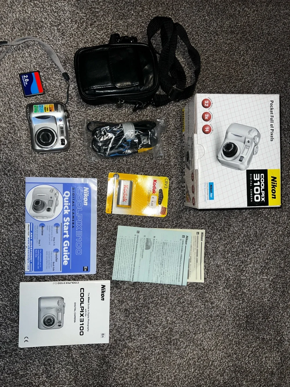 Nikon Silver Compact Digital Camera with Accessories